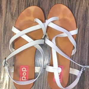 Worn White and tan sandals
